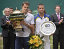 Roger Federer and Mikhail Youzhny pose with their trophies at Halle