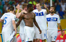 Mario Balotelli is mobbed by his team-mates