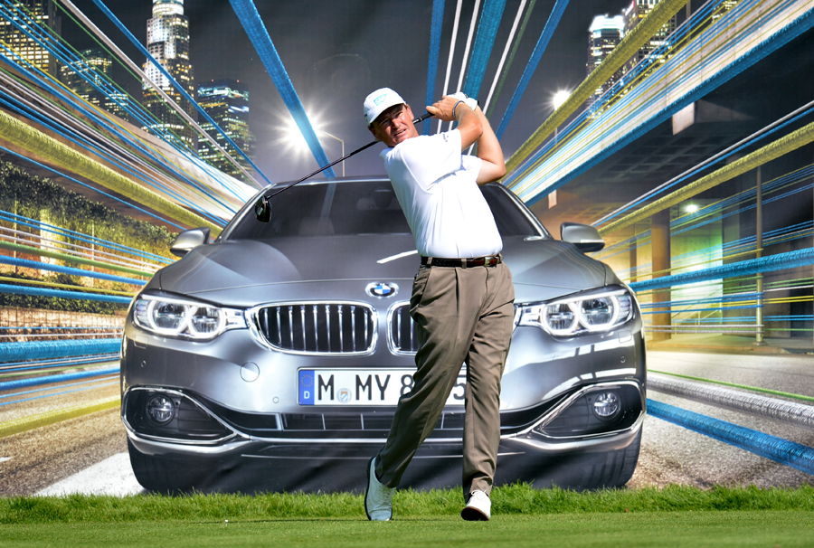Ernie Els tees off in front of a hoarding