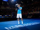 Roger Federer lifts the Australian Open Trophy