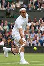 Roger Federer goes low for a shot