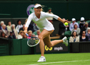 Maria Sharapova stretches for a return