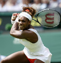 Serena Williams hits through a backhand