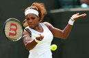 Serena Williams plays a forehand
