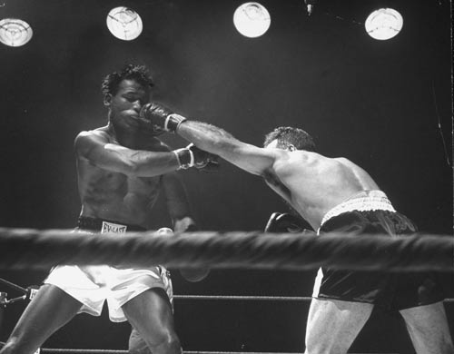 Jake La Motta lands a punch during a title fight with Sugar Ray Robinson