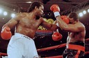 Lennox Lewis lands a punch on Oliver McCall