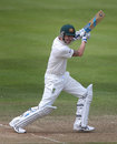 Michael Clarke hits the ball square through the offside