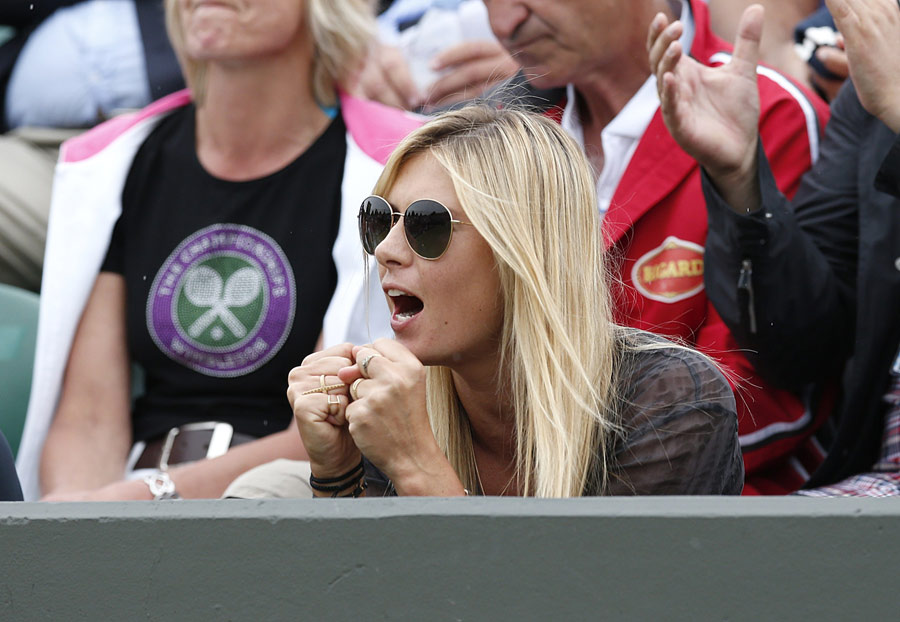 Maria Sharapova watches the action
