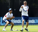 Graeme Swann takes a catch in practice as Alastair Cook looks on
