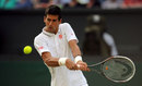 Novak Djokovic focuses on a backhand