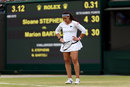 Marion Bartoli stands dejected on court