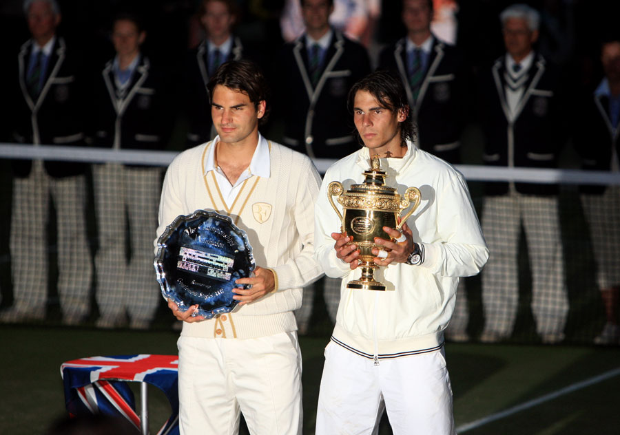 Roger Federer and Rafael Nadal pose with their trophies
