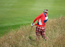 Ian Poulter hacks out of the rough 