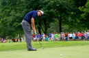 Phil Mickelson strokes in a putt