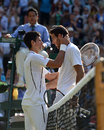 Novak Djokovic and Juan Martin Del Potro embrace at the net