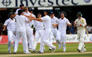 England players run to Andrew Flintoff