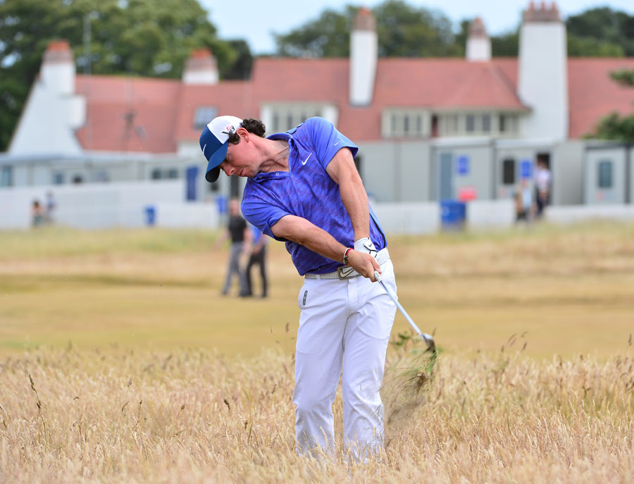 Rory McIlroy practises in the long grass