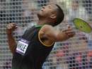 Traves Smikle competes in the men's discus throw qualifications
