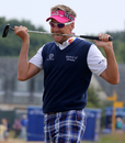 Ian Poulter chews his putter