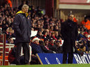 Arsene Wenger and Jose Mourinho stand on the touchline