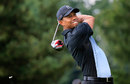 Tiger Woods hits off the 13th tee
