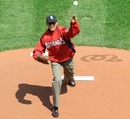 US president Barack Obama throws out the opening pitch 