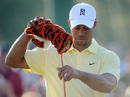 Tiger Woods takes the cover off his driver