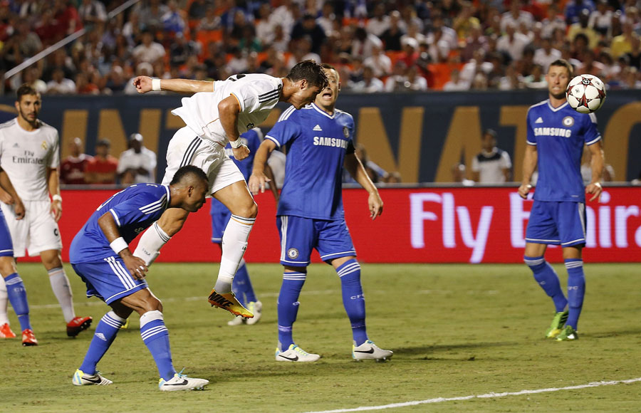 Cristiano Ronaldo heads his side's third goal