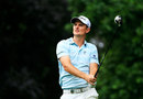 Justin Rose hits off the fifth tee