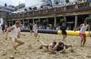 Competitors play in a beach rugby tournament at Covent Garden