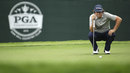 Jason Dufner lines up a putt on the eighth hole 