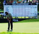 Jason Dufner rolls home his final putt of the day