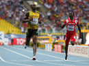Usain Bolt crosses the line