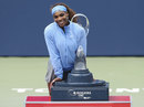 Serena Williams shows off the trophy