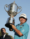 Jason Dufner holds up the Wanamaker Trophy