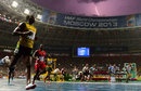 Usain Bolt wins the 100m as a lightning bolt strikes over the stadium