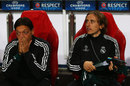 Mesut Ozil and Luka Modric look on from the bench