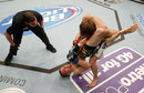 Michael McDonald (bottom) secures a triangle choke submission against Brad Pickett