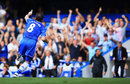 Frank Lampard points to the stands as Jose Mourinho celebrates on the touchline