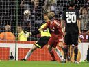 Dirk Kuyt beats the goalkeeper to the ball