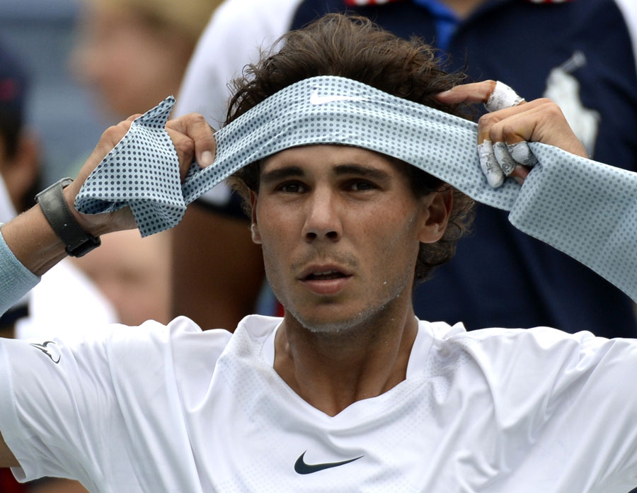 Rafael Nadal prepares his headband