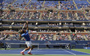 Roger Federer cruised into the third round of the US Open, beating Carlos Berlocq in straight sets