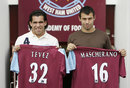 Carlos Tevez and Javier Mascherano pose with their West Ham shirts