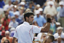 Novak Djokovic reacts to the crowd