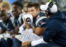 Tim Tebow sits with offensive coordinator Josh McDaniels