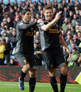 Luis Suarez and Steven Gerrard celebrate