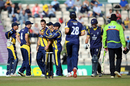Jim Allenby is congratulated by his Glamorgan team-mates after taking the wicket of James Vince 