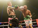 Raymundo Beltran takes a blow from Ricky Burns but was not awarded the win following a controversial draw