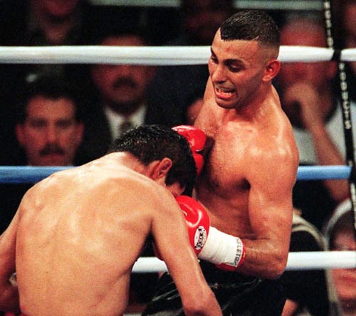Prince Naseem Hamed delivers a punch to Ceasar Soto