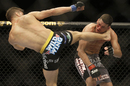 Nate Diaz receives a kick in his bout with Josh Thompson